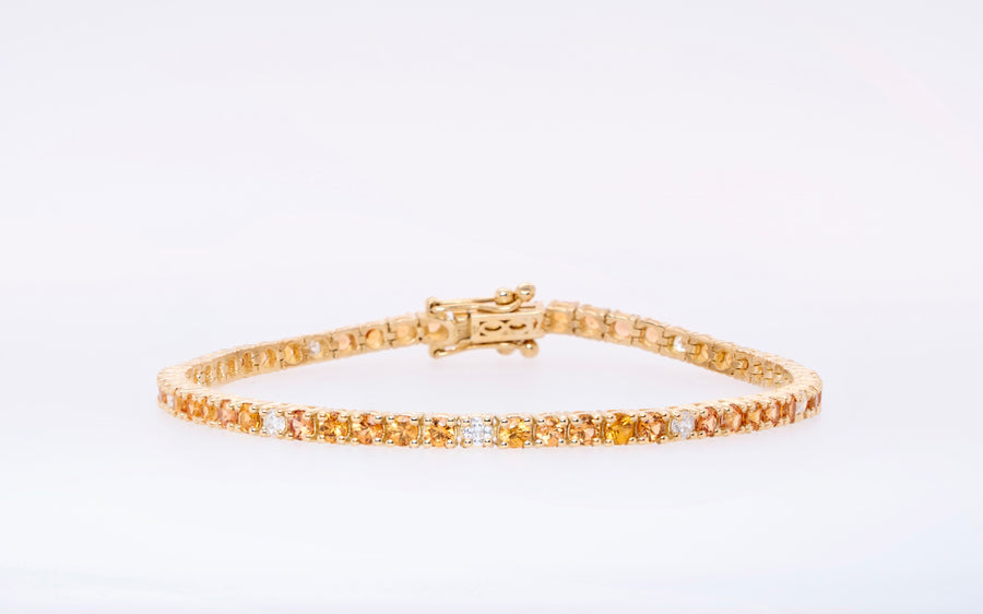 Orange stones 18k gold tennis bracelet