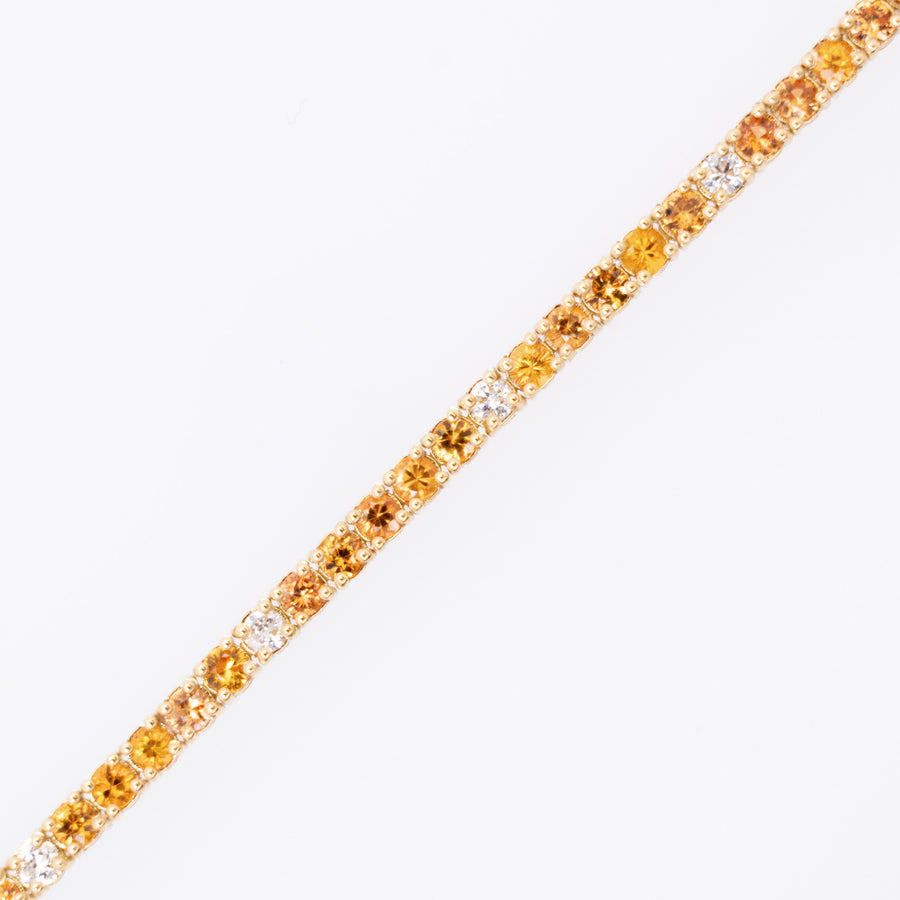 Orange stones 18k gold tennis bracelet